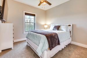 a bedroom with a bed and a window at Modern Sadieville Home with Yard and Gas Grill! in Corinth