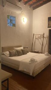 Una cama o camas en una habitación de Maria Mulata Boutique Hotel