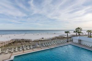 an aerial view of a swimming pool and the beach at Pelican Pointe 504 in Orange Beach