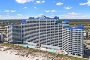 an aerial view of a large building on the beach at Lighthouse By Liquid Life in Gulf Shores