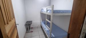 a room with two bunk beds in a room at alojamentohostel in Primavera do Leste +8 photos
