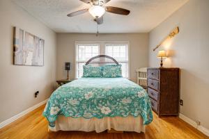 a bedroom with a bed and a ceiling fan at Lakefront Leesburg Home with Private Dock and Ramp! in Centre