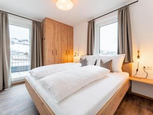 Posteľ alebo postele v izbe v ubytovaní Falken Suites TOP 5
