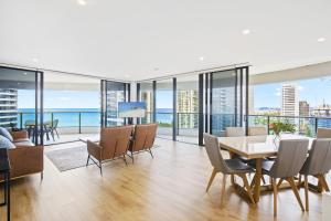 a dining room with a view of the ocean at Oracle 2 1907 in Gold Coast