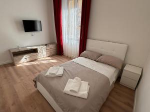 Postel nebo postele na pokoji v ubytování GALiLEO PiSA