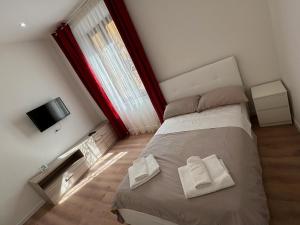 Postel nebo postele na pokoji v ubytování GALiLEO PiSA
