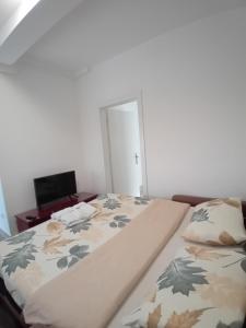 Postel nebo postele na pokoji v ubytování WING 3 apartman ,,BC ,,