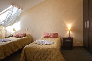 Säng eller sängar i ett rum på Selivanov Hotel