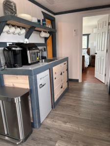 a kitchen with a counter with a sink and a stove at Mystic Mountain Retreat in Miramonte