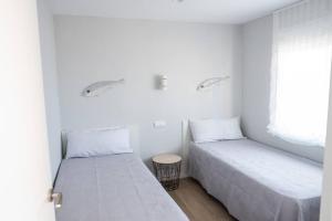 Ένα ή περισσότερα κρεβάτια σε δωμάτιο στο Seaside Views Apartment in Salou