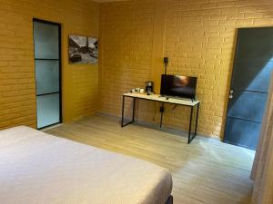 TV a/nebo společenská místnost v ubytování Casa Patio - Habitacion 5