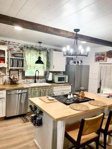 a kitchen with a table and a counter top at Countryside Haven in Pickens