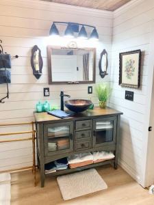 a bathroom with a sink and a mirror at Countryside Haven in Pickens