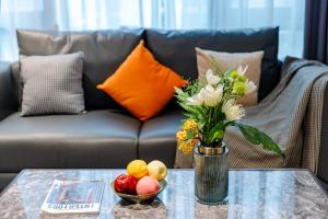 Χώρος καθιστικού στο East Maple Hotel Apartment - Guangzhou Financial City Sanxi Metro Station