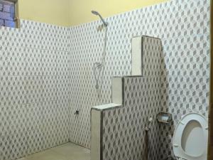 Vannituba majutusasutuses Three V Homestay