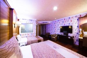 Televiisor ja/või meelelahutuskeskus majutusasutuses Wen Sha Bao Motel-Xinying