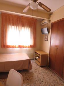 Postel nebo postele na pokoji v ubytování Hotel Alain