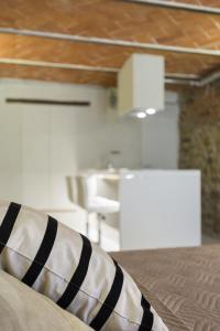 a black and white pillow on a bed in a room at Loft n°18 in Arezzo