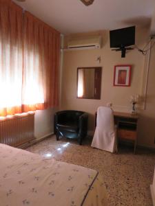 Postel nebo postele na pokoji v ubytování Hotel Alain