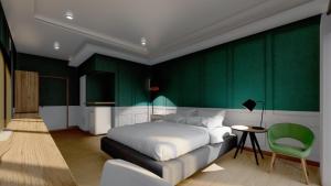 Cama ou camas em um quarto em J2 Hotel