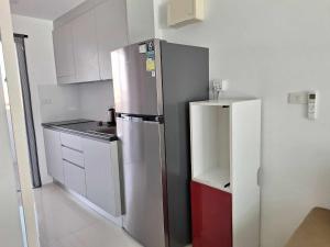 Kuchyň nebo kuchyňský kout v ubytování Mantra condo by malai