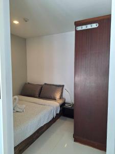 Postel nebo postele na pokoji v ubytování Mantra condo by malai
