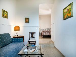 a living room with a couch and a table at Hotel Bel Soggiorno in Taormina