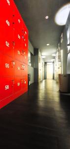 a hallway with red lockers in a building at Guesthouse@ Bukit Bintang in Kuala Lumpur