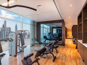 a gym with exercise equipment in a building at Luxury 5 Star Cando in Dubai in Dubai