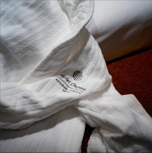 a white shirt with a price tag on it at Hotel Onoma Daejeon, Autograph Collection in Daejeon