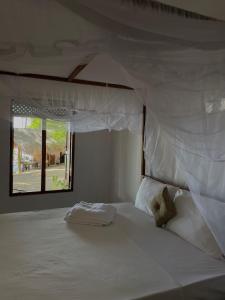 Postel nebo postele na pokoji v ubytování Ocean Vibe Srilanka