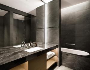 a bathroom with a sink and a shower at Hotel Onoma Daejeon, Autograph Collection in Daejeon