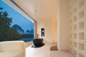 صورة لـ Mochi Luxury River View Resort Hotel (Yangshuo Xingping Ancient Town Lijiang Branch) في يانغتشو