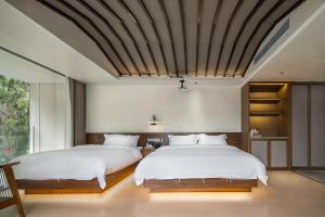 صورة لـ Mochi Luxury River View Resort Hotel (Yangshuo Xingping Ancient Town Lijiang Branch) في يانغتشو