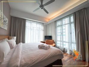 a bedroom with a white bed and large windows at Pavilion Suites KLCC Bukit Bintang at Cormar by NHB in Kuala Lumpur