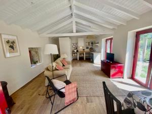 a living room with a couch and a table at Casa de Cossourado in Cossourado