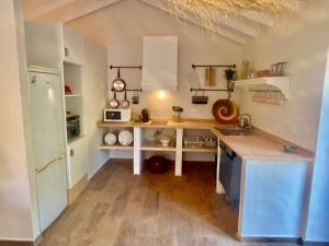 a kitchen with a sink and a counter top at Casa de Cossourado in Cossourado