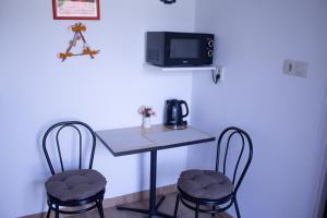 A television and/or entertainment centre at Sándor Apartman