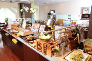 a buffet line with food on display in a store at Hotel Hokke Club Niigata Nagaoka in Nagaoka