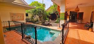 a swimming pool in the middle of a house at The GWK View in Jimbaran