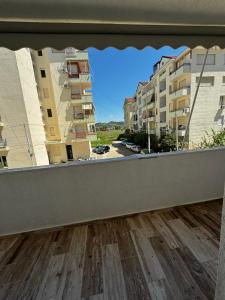a view from a balcony with buildings in the background at GOLEM Best Apartment in Golem