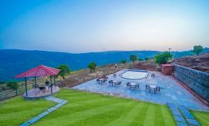 an overhead view of a swimming pool in a yard at Trattino Resorts in Panchgani