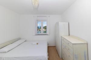Postel nebo postele na pokoji v ubytování Penthouse Ugljan by Belmont Realty