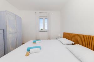 Postel nebo postele na pokoji v ubytování Penthouse Ugljan by Belmont Realty