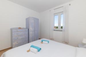 Postel nebo postele na pokoji v ubytování Penthouse Ugljan by Belmont Realty