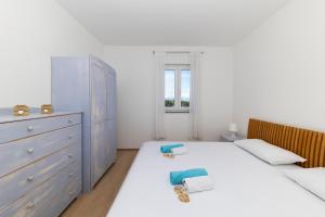 Postel nebo postele na pokoji v ubytování Penthouse Ugljan by Belmont Realty