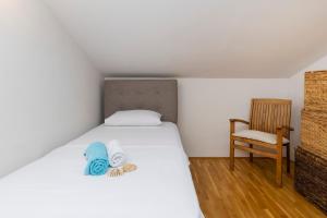 Postel nebo postele na pokoji v ubytování Penthouse Ugljan by Belmont Realty