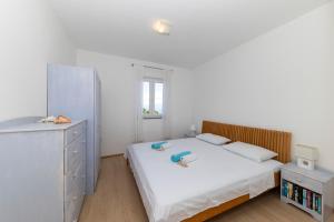 Postel nebo postele na pokoji v ubytování Penthouse Ugljan by Belmont Realty