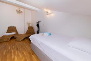 Postel nebo postele na pokoji v ubytování Penthouse Ugljan by Belmont Realty