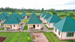 an overhead view of a row of houses with green roofs at Grace Resort in Homa Bay